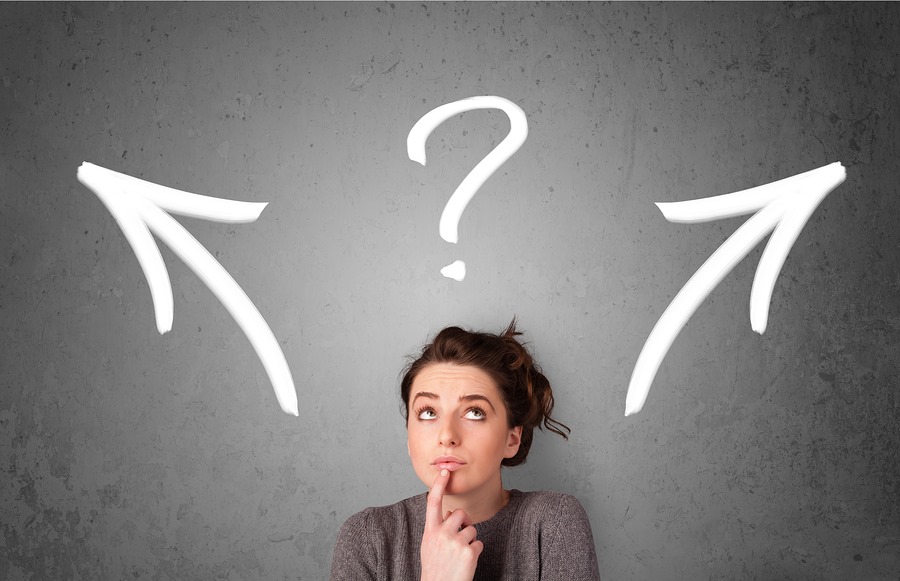 Decision-Making person looking up at a questionmark and arrows pointing left and right