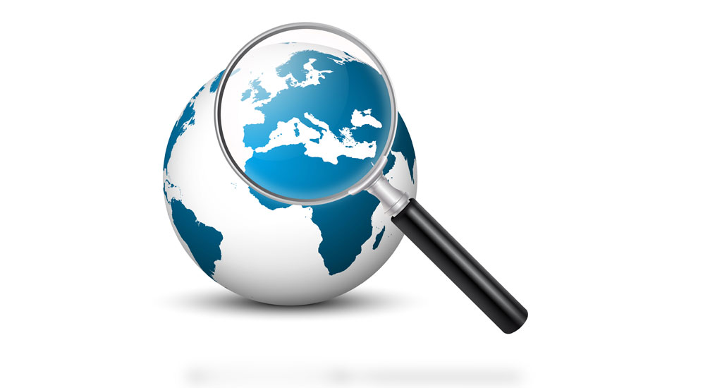 a magnifying glass over a globe